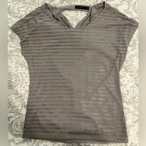 Grey/silver short sleeve blouse. Keyhole cut out in the back.